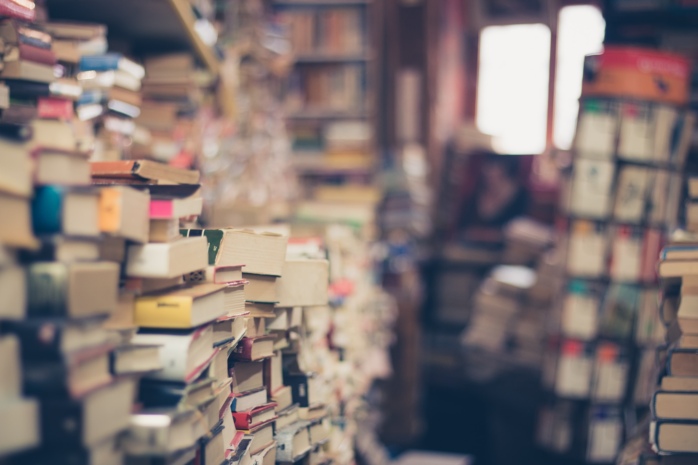 Piles of books in a second-hand bookshop